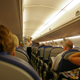 Where you sit on a plane determines how often you get up and move around, new research suggests.